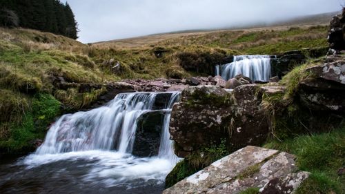 Scenic view of waterfall in forest