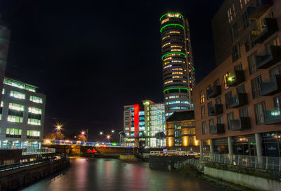 Illuminated buildings in city at night