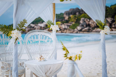 Close-up of decoration on table at beach