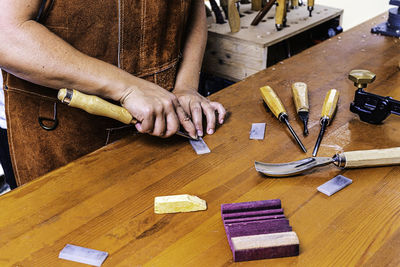 Wood craftswoman sharpening tool with stone