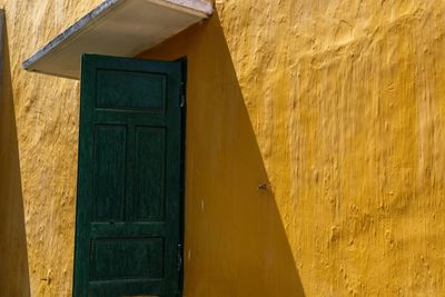 Close-up of yellow door of house