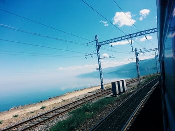 Railway tracks against blue sky