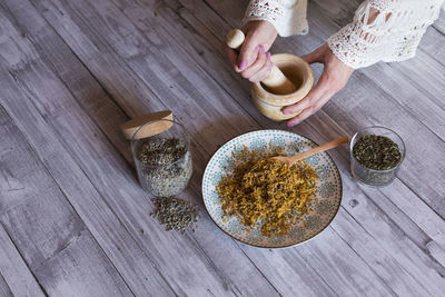 High angle view of woman preparing food on table