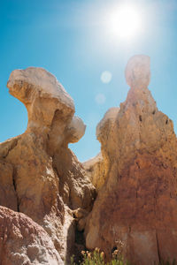 Low angle view of rock formation against sky