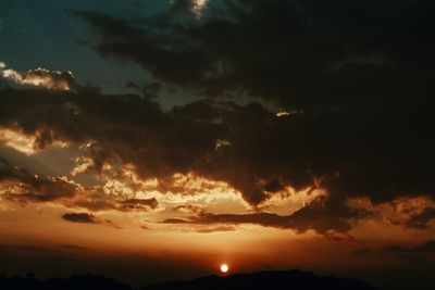 Scenic view of dramatic sky during sunset