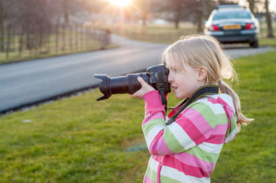 Full length of a girl photographing