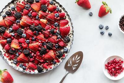 Above view of a delicious mixed berry cheesecake tart, ready for serving.