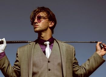 Portrait of young man against white background