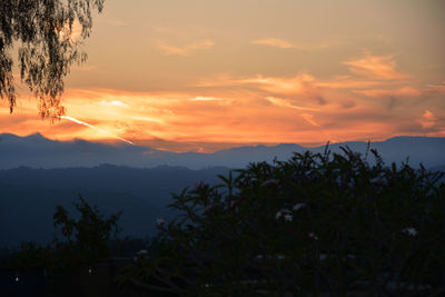 Scenic view of landscape against sky during sunset