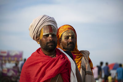 Portrait of man wearing traditional clothing against sky