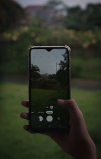 Human hand holding smart phone