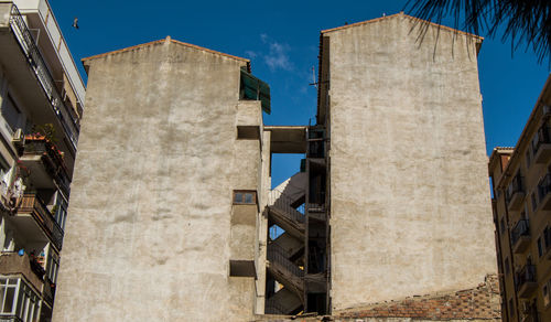 Low angle view of buildings against clear sky