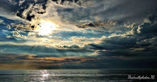 Scenic view of sea against sky at sunset