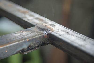 High angle view of barbed wire on wooden table