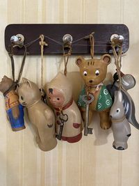 Close-up of toys hanging against wall