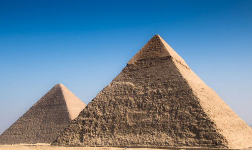 Low angle view of historical building against blue sky