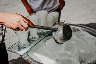 Cropped hand of man washing hands