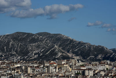 Rocky mountains with houses in foreground