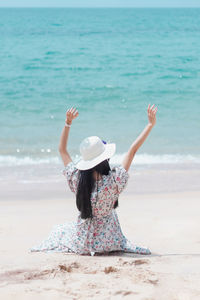 Happy woman hat enjoy summer vacation on the beach.