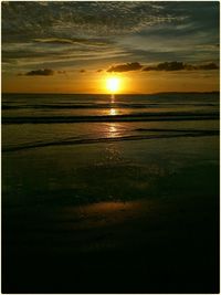 Scenic view of sea at sunset