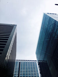 Low angle view of modern buildings against sky