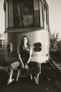 High angle view of man sitting on road
