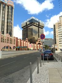 View of buildings against cloudy sky