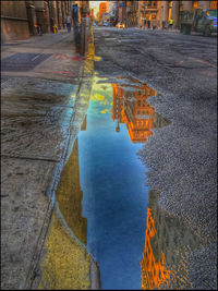 Reflection of buildings in puddle