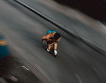 High angle view of man skateboarding on street
