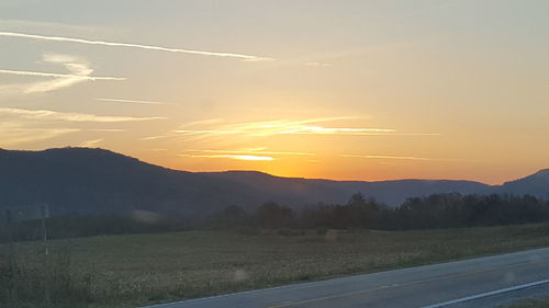 Scenic view of landscape against sky during sunset