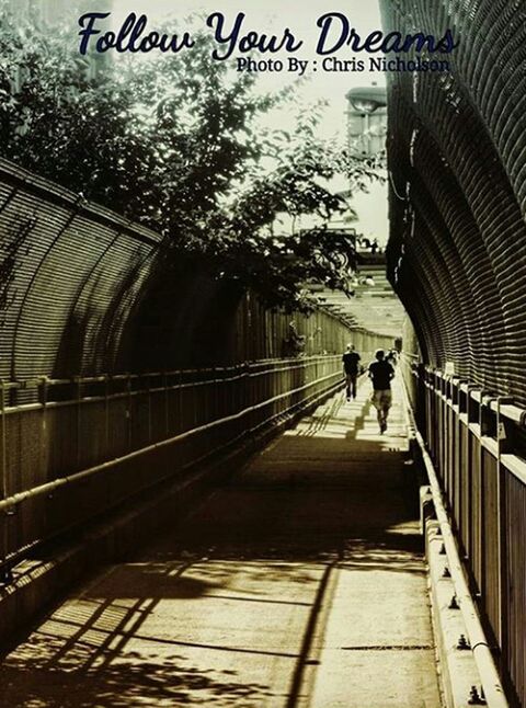 PEOPLE IN FOOTBRIDGE