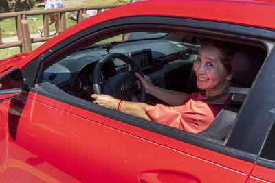 Portrait of man sitting in car