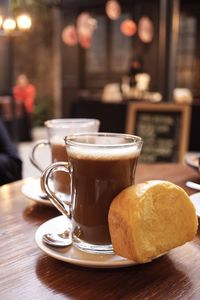 Close-up of coffee served on table in cafe