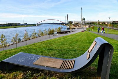 View of bridge over river against cloudy sky
