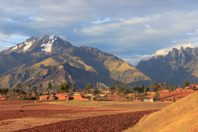 Scenic view of landscape and mountains against sky