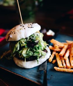 Close-up of burger in serving tray on table