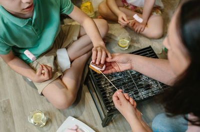 High angle view of kids eating barbecue food