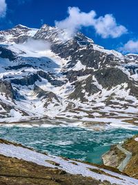 Aerial view of snowcapped mountains against sky