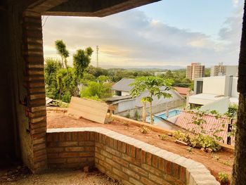 High angle view of trees and buildings against sky