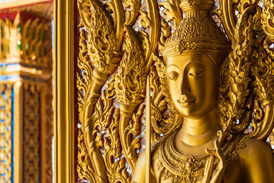 Close-up of buddha statue in temple