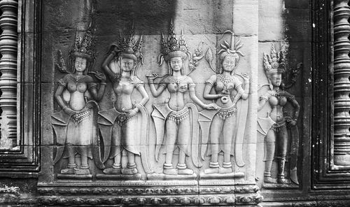 Low angle view of statue against temple