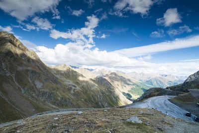 Scenic view of mountains against cloudy sky