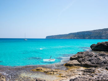 Scenic view of sea against clear sky