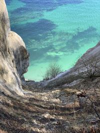 High angle view of rocks by sea