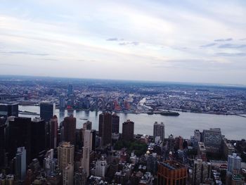 High angle view of modern buildings in city against sky