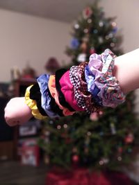 Close-up of girl holding christmas tree