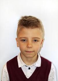 Portrait of boy against white background