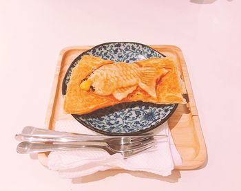 Close-up of cake against white background