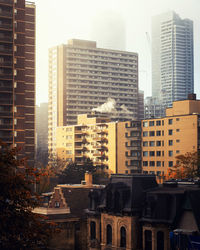 Modern buildings in city against sky