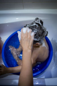 Close-up of hands in bathroom